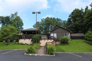 a house with a gazebo in a parking lot at Higher Altitude in Gatlinburg