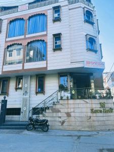 a motorcycle parked in front of a building at Hotel Shree Narayan Palace in Jaipur