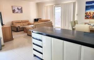 a kitchen and living room with a large counter top at Unit 59 Seafront Estate in Jurien Bay