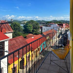 a view of a city from a balcony at AIDA HOSTAL in Flores