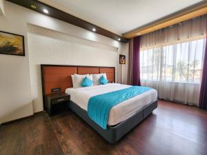 Dimora Hotels And Resorts客房内的一张或多张床位