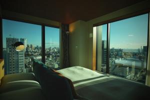 Postel nebo postele na pokoji v ubytování THE AOYAMA GRAND HOTEL