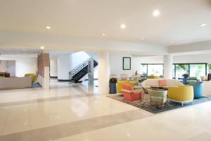 a lobby with colorful chairs and tables in a building at Sheraton Miami Airport Hotel and Executive Meeting Center in Miami