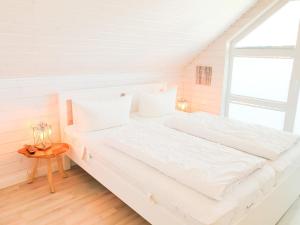 Postel nebo postele na pokoji v ubytování Ferienhaus Ostseelodge