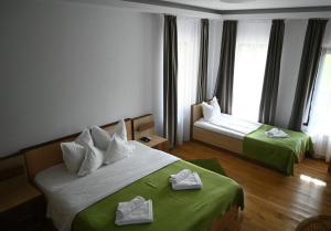 Postel nebo postele na pokoji v ubytování Egreta By Hoxton