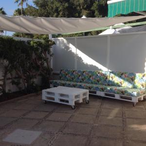 a couch sitting under a tent on a patio at Bungalow Maspalomas in Maspalomas