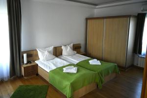 Postel nebo postele na pokoji v ubytování Egreta By Hoxton
