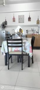 a model of a kitchen with a table and chairs at Hana Homestay The Heights Residence in Ayer Keroh