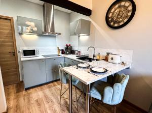 Kuchnia lub aneks kuchenny w obiekcie Le Garden & SPA