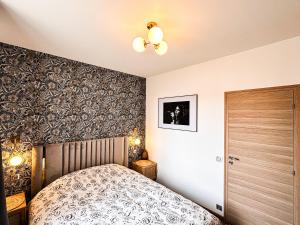 Łóżko lub łóżka w pokoju w obiekcie Le Garden & SPA