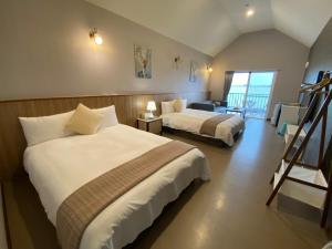Postel nebo postele na pokoji v ubytování Loju Seaview Homestay + 37 fotografií
