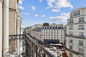 a view of a city from a balcony at Margot in Paris