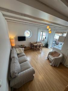 a living room with a couch and a table at Apartamenty Tęcza in Świnoujście