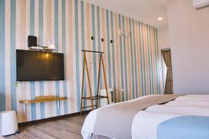 Posteľ alebo postele v izbe v ubytovaní Loju Seaview Homestay