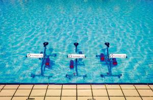 a group of fourimmers in a swimming pool at TUI Magic Life Candia Maris - Adults Only in Amoudara Herakliou