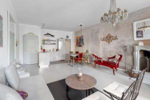 a living room with a couch and a table at Casa Elena Lago - Maggiore Estate by Ginin in Cannobio