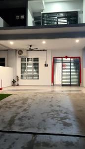 an empty room with a garage with a door at 9 Homestay - Feel like home . in Muar