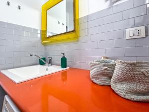 a bathroom with a sink and a mirror at Casa Giò in Pescara