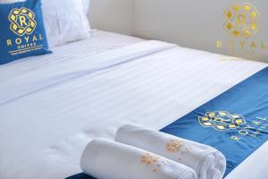 Postel nebo postele na pokoji v ubytování Royal Suites Studio 07RW - Nuvasa Bay Resort + 21 fotografií