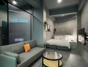 Postel nebo postele na pokoji v ubytování All-Ur Boutique Motel-Ping Tung Branch