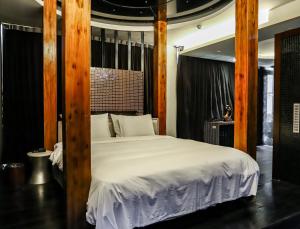 Postel nebo postele na pokoji v ubytování All-Ur Boutique Motel-Ping Tung Branch