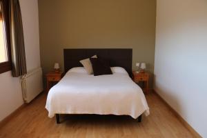 Postel nebo postele na pokoji v ubytování Hotel Balcó del Priorat