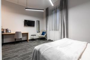 Posteľ alebo postele v izbe v ubytovaní VANTA Business Center + 37 fotografií