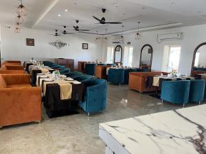 Restoranas ar kita vieta pavalgyti apgyvendinimo įstaigoje Hotel Eco Park Rewa