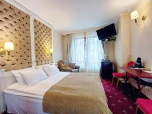 TV a/nebo společenská místnost v ubytování Pegasa Pils Spa Hotel