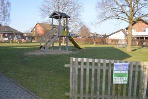 a playground with a slide in a park at Almer Ferienwohnung in Brilon