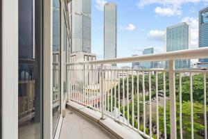 a balcony with a view of the city at Veloura by Kozystay - Setiabudi in Jakarta