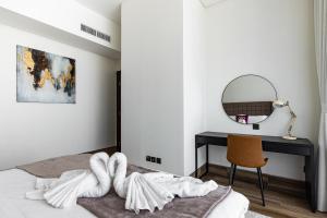 Ένα ή περισσότερα κρεβάτια σε δωμάτιο στο SIMPLY COMFORT in J ONE Tower