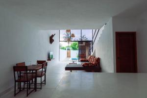 a living room with a couch and a table at Trio Villas Watamu in Watamu