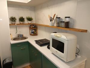 Kuchyň nebo kuchyňský kout v ubytování Appartement tout confort