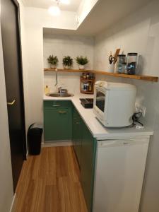 Kuchyň nebo kuchyňský kout v ubytování Appartement tout confort