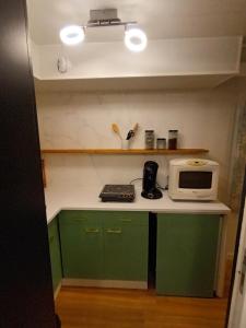 Kuchyň nebo kuchyňský kout v ubytování Appartement tout confort