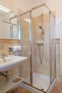 a bathroom with a shower and a sink at Villa Cri Cri B&B di Charme in San Benedetto del Tronto