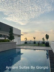 a swimming pool on the roof of a building at Subang Jaya Armani Soho in Subang Jaya