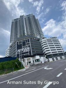 a large apartment building with a sign in front of it at Subang Jaya Armani Soho in Subang Jaya