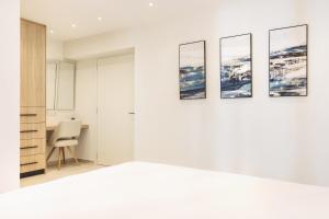 Un pat sau paturi într-o cameră la Mamfredas Luxury Residence