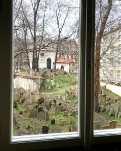a view of a cemetery from a window at Golem in Prague