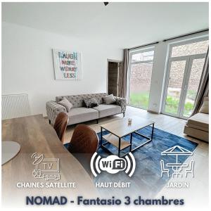 a living room with a couch and a table at NOMAD APARTMENTS - Henin in Charleroi