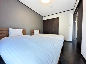 Postel nebo postele na pokoji v ubytování 72 Mt View - B棟 -