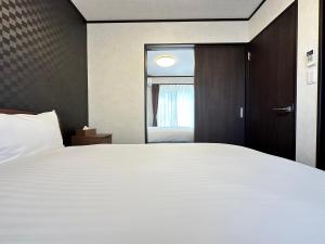 Postel nebo postele na pokoji v ubytování 72 Mt View - B棟 -