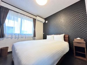 Postel nebo postele na pokoji v ubytování 72 Mt View - B棟 -