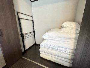 Postel nebo postele na pokoji v ubytování 72 Mt View - B棟 -