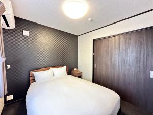 Postel nebo postele na pokoji v ubytování 72 Mt View - B棟 -