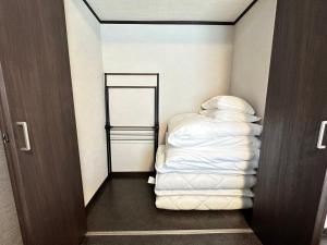 Postel nebo postele na pokoji v ubytování 72 Mt View - B棟 -
