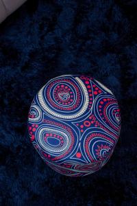 a design on a ball on a blue carpet at Superb High spec Studios . Kabete. 15 Mins from Westlands in Nairobi