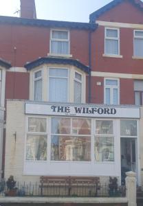 a building with a sign that reads the wilfred at THE WILFORD HOTEL in Blackpool